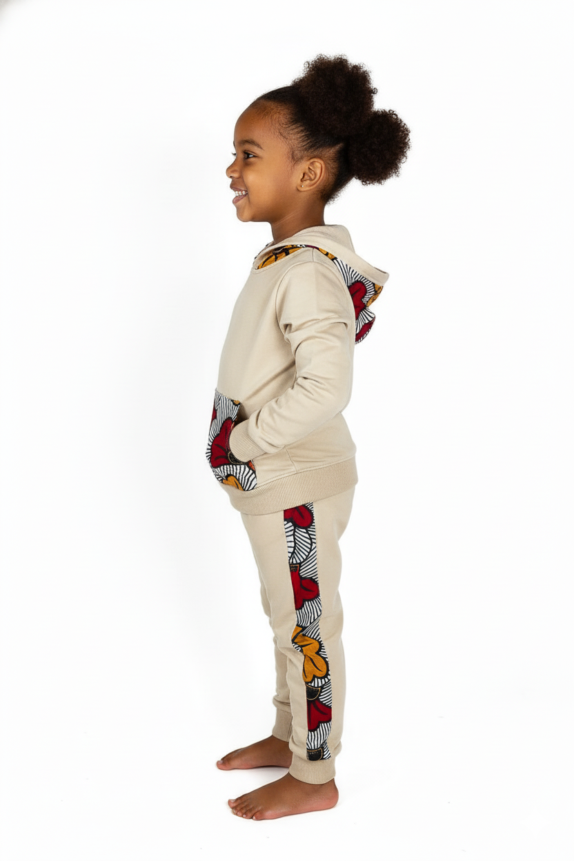 Jogging afro chic MPESA enfant fille ou garçon, confortable et stylé, 65 % coton 35 % polyester, détails artisanaux en wax 100 % coton.