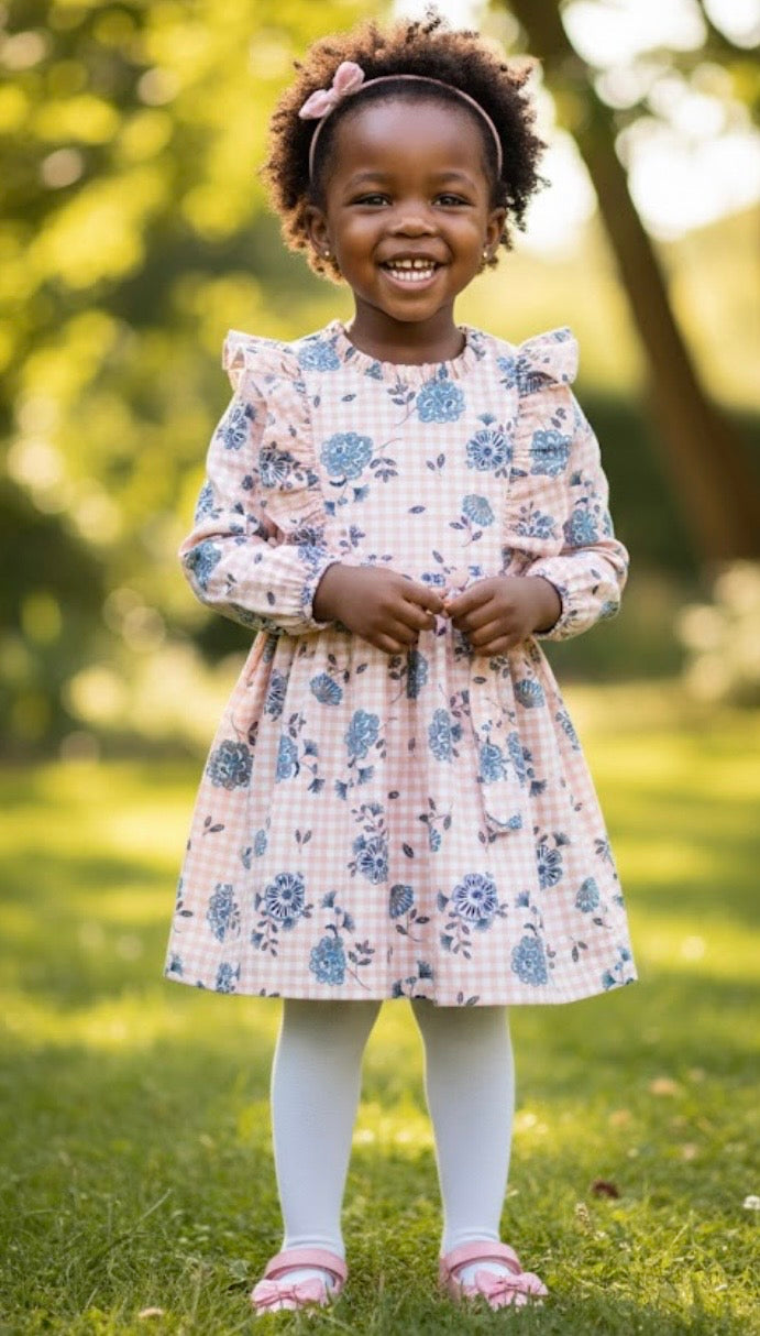 Robette fillette FLORA faite main en coton, manches longues avec élastique au poignet, nœud à l’arrière et motif floral.